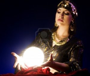 7113279-fortune-teller-reads-the-future-in-glowing-crystal-ball